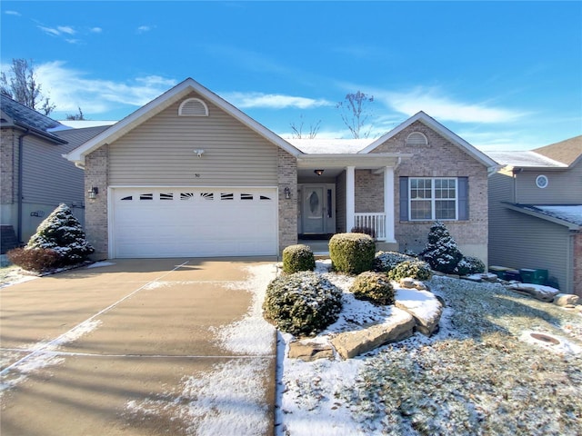 ranch-style home with an attached garage, driveway, and brick siding