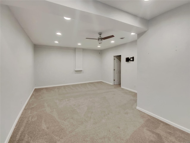 unfurnished room featuring a ceiling fan, recessed lighting, light carpet, and baseboards