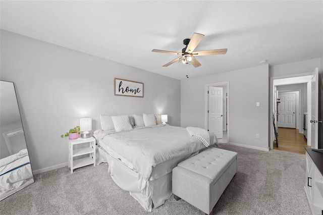 bedroom featuring carpet flooring, a ceiling fan, and baseboards