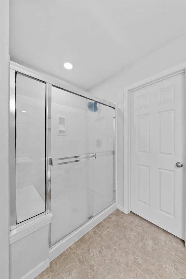 full bathroom with a stall shower