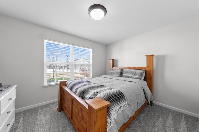 bedroom with baseboards and carpet floors