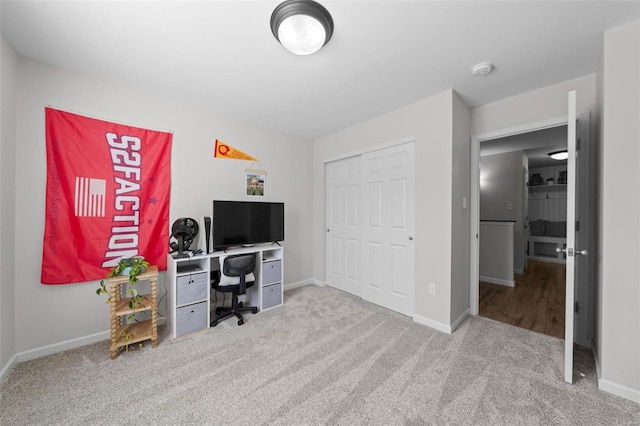 carpeted home office with baseboards