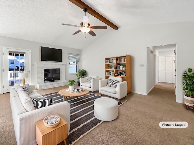 living area featuring vaulted ceiling with beams, a textured ceiling, carpet, and a fireplace