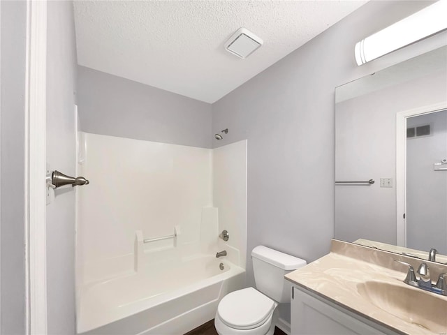 full bathroom with visible vents, toilet, vanity, a textured ceiling, and  shower combination