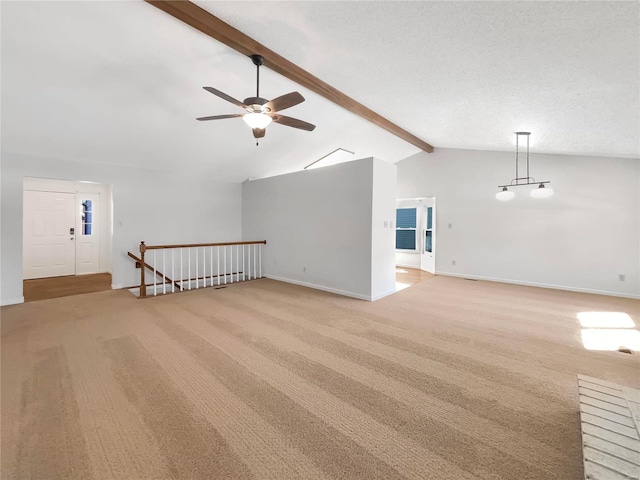 unfurnished room with ceiling fan, high vaulted ceiling, light carpet, baseboards, and beamed ceiling