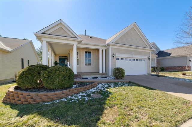 view of front of home with a garage, driveway, and a front lawn