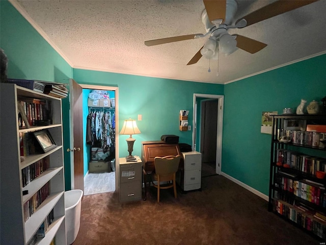 office featuring a textured ceiling, ornamental molding, carpet flooring, and a ceiling fan