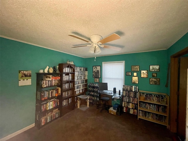 carpeted office space featuring a ceiling fan, crown molding, a textured ceiling, and baseboards