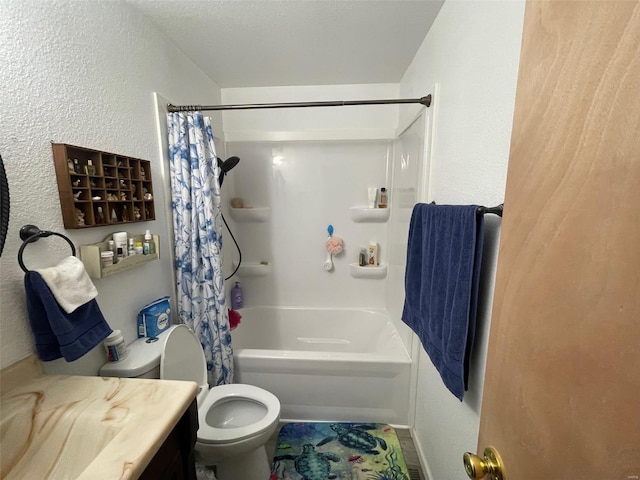 bathroom featuring a textured wall, vanity, toilet, and shower / bath combo with shower curtain