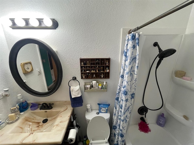 full bathroom featuring toilet, shower / bathtub combination with curtain, vanity, and a textured wall