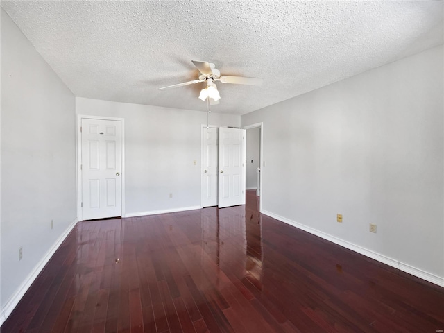 unfurnished room featuring ceiling fan, baseboards, and wood finished floors