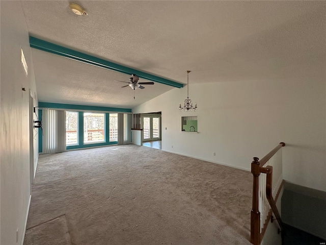 unfurnished living room with baseboards, lofted ceiling with beams, a textured ceiling, carpet flooring, and ceiling fan with notable chandelier