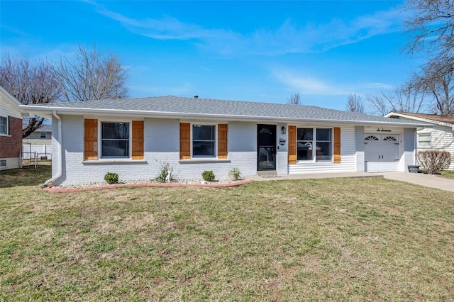 single story home featuring brick siding, an attached garage, driveway, and a front yard