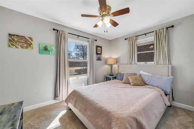 carpeted bedroom with baseboards and ceiling fan