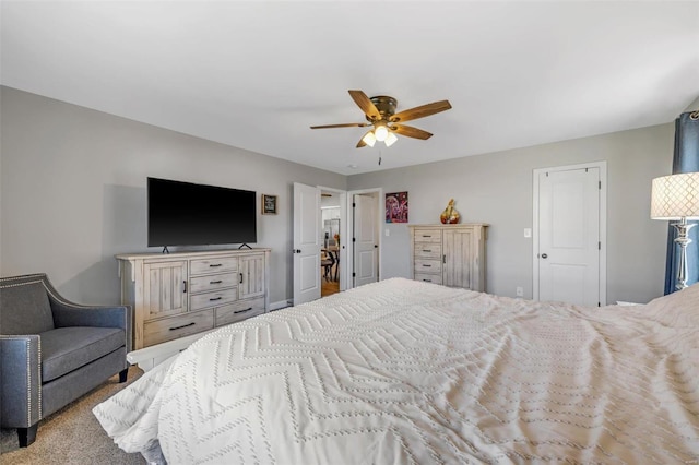 carpeted bedroom with a ceiling fan