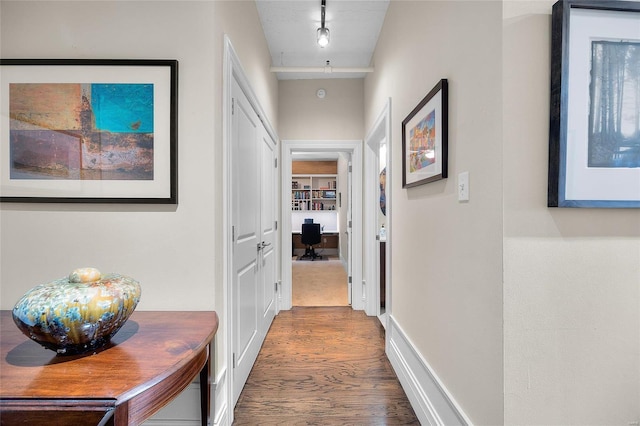 hallway with wood finished floors