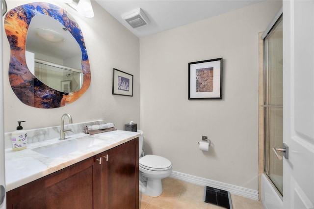 bathroom with tile patterned flooring, toilet, vanity, visible vents, and baseboards