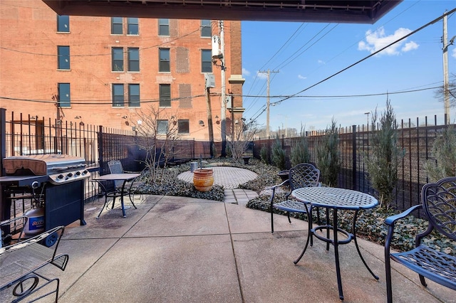 view of patio featuring a fenced backyard and grilling area