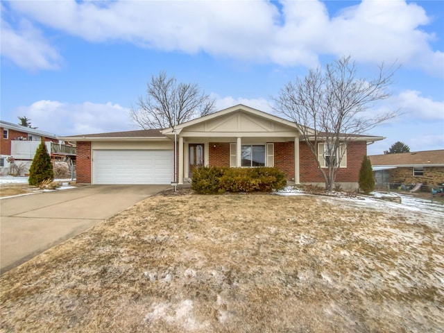 ranch-style home with brick siding, driveway, and an attached garage