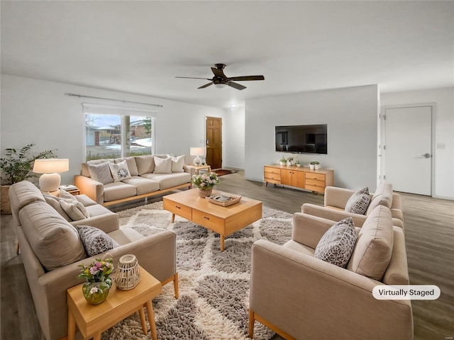 living area featuring ceiling fan and wood finished floors