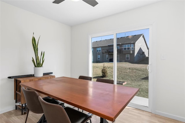 interior space featuring baseboards, ceiling fan, and light wood-style floors