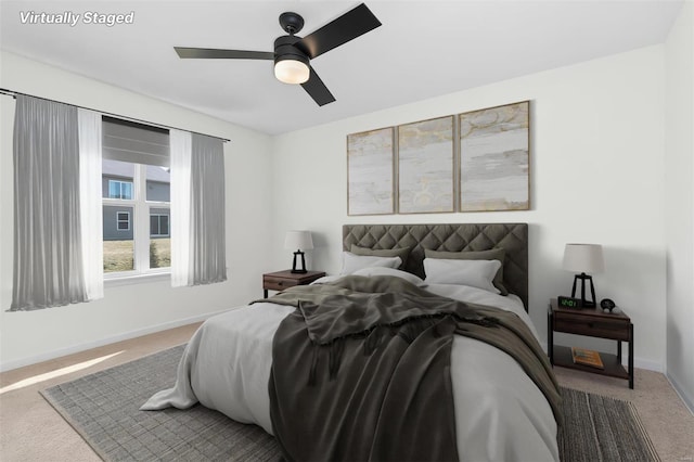 bedroom featuring carpet, baseboards, and ceiling fan