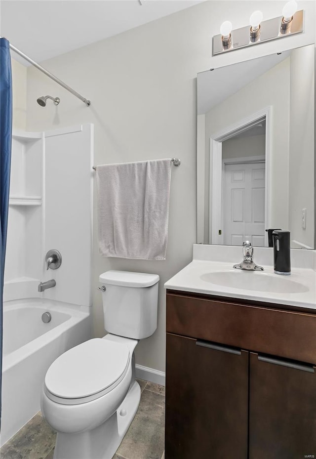 bathroom with vanity, shower / bath combination with curtain, and toilet