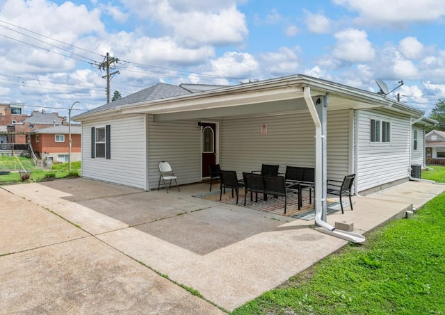 back of property featuring central AC and a patio