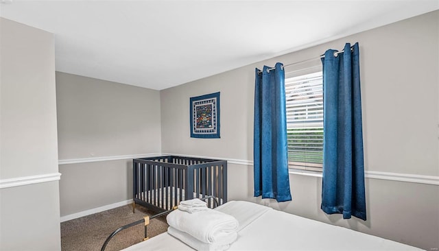 carpeted bedroom with baseboards