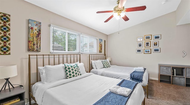 bedroom featuring a ceiling fan, carpet, lofted ceiling, and baseboards