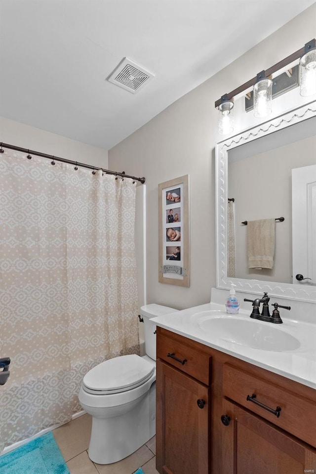 full bath featuring toilet, vanity, tile patterned flooring, and visible vents