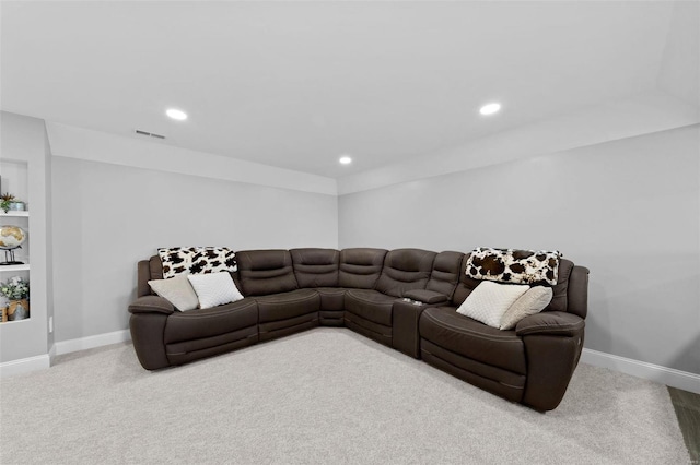 carpeted living room featuring visible vents, baseboards, and recessed lighting