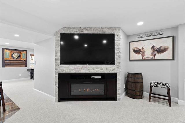 carpeted living area with recessed lighting, a fireplace, and baseboards