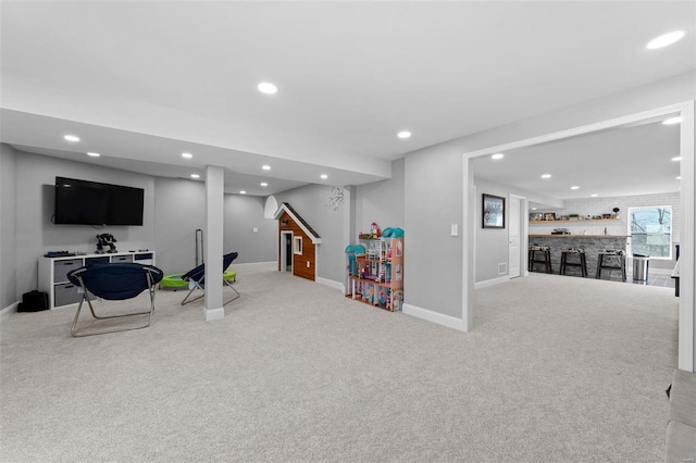 rec room featuring baseboards, a dry bar, carpet, and recessed lighting