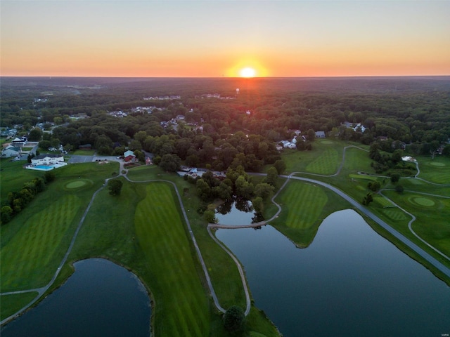 aerial view at dusk with a water view