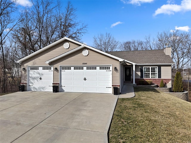 single story home featuring driveway, a garage, a chimney, a front yard, and brick siding