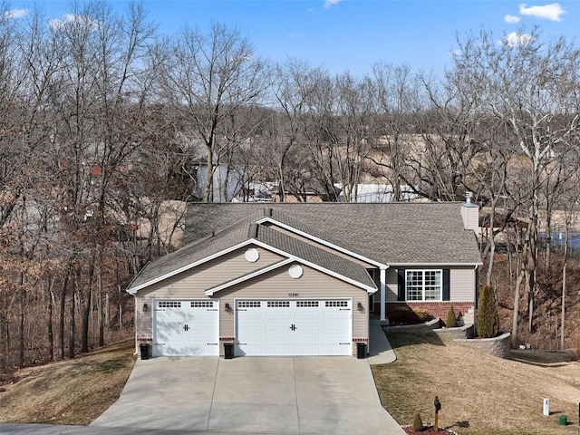 ranch-style house featuring concrete driveway, a front lawn, a chimney, and an attached garage