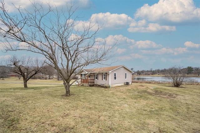 exterior space featuring a water view and a front yard