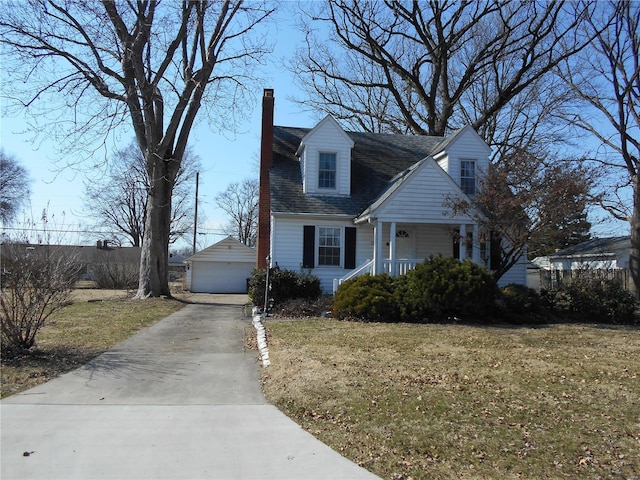 cape cod-style house featuring a garage, a chimney, covered porch, an outdoor structure, and a front yard