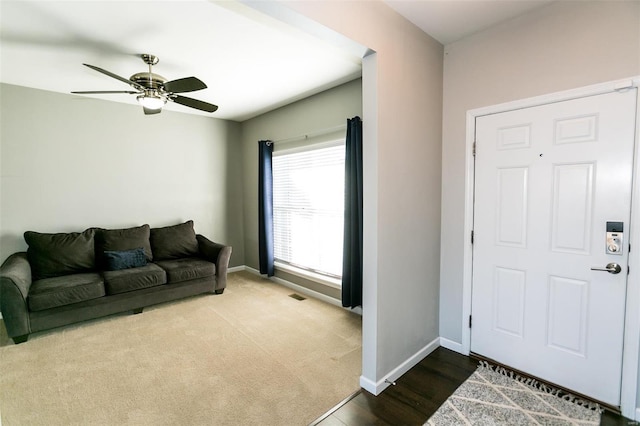 entrance foyer with ceiling fan, visible vents, and baseboards