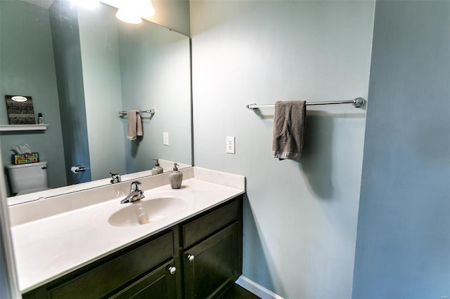 bathroom with toilet and vanity