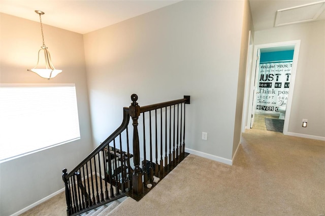 stairs featuring carpet floors and baseboards