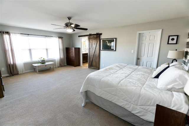 bedroom with baseboards, a barn door, a ceiling fan, and light colored carpet