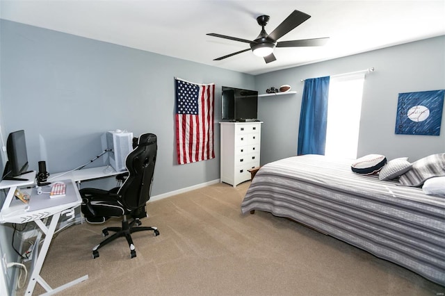 bedroom with light colored carpet, ceiling fan, and baseboards