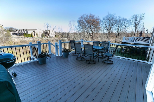 deck with outdoor dining area