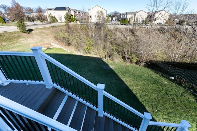 view of yard featuring a deck and fence