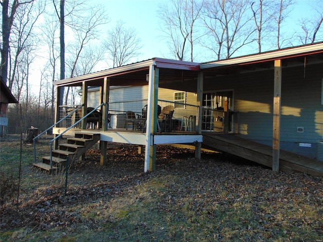 rear view of property featuring crawl space