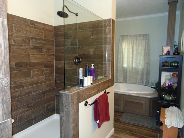 bathroom featuring a walk in shower, ornamental molding, wood finished floors, and a bath