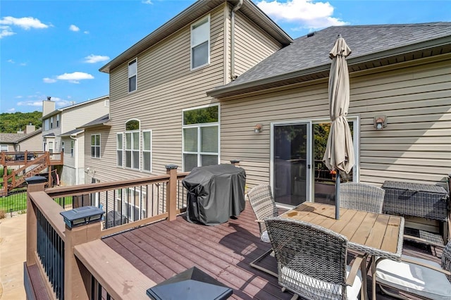 wooden terrace featuring grilling area