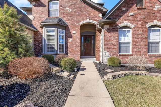 entrance to property with brick siding